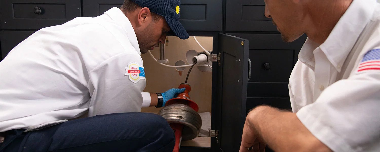 plumber fixing sink