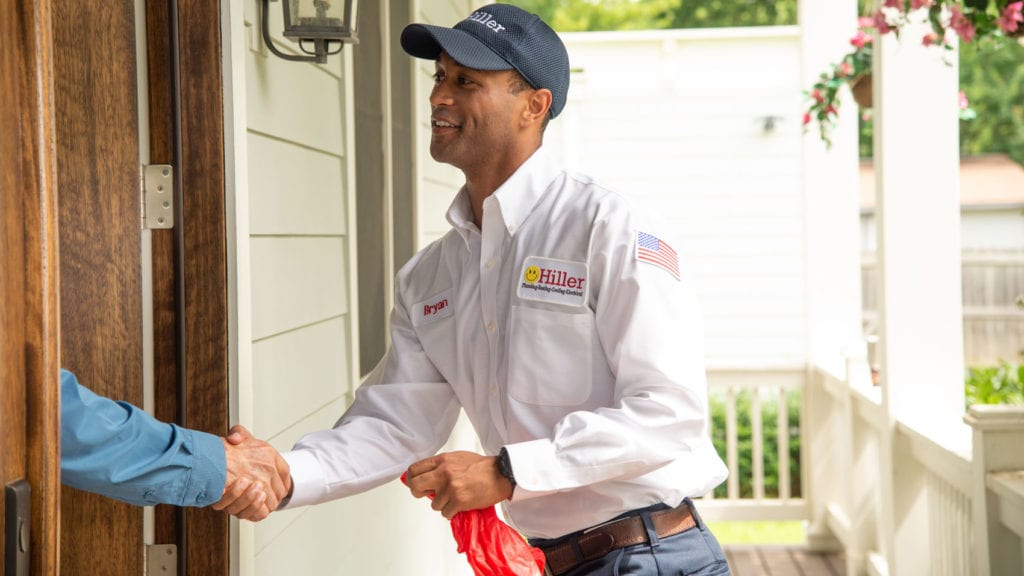 Hiller electrician shaking hand