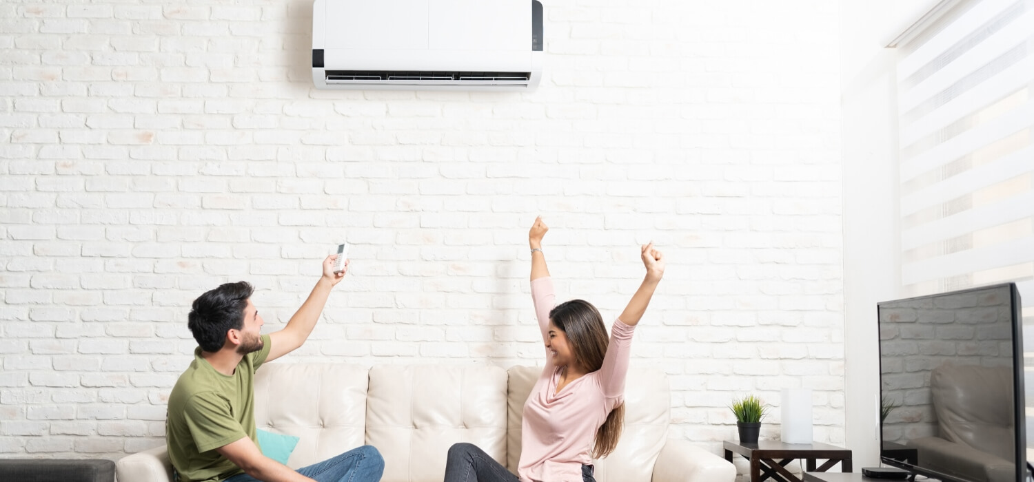 couple relaxing with ductless air conditioner