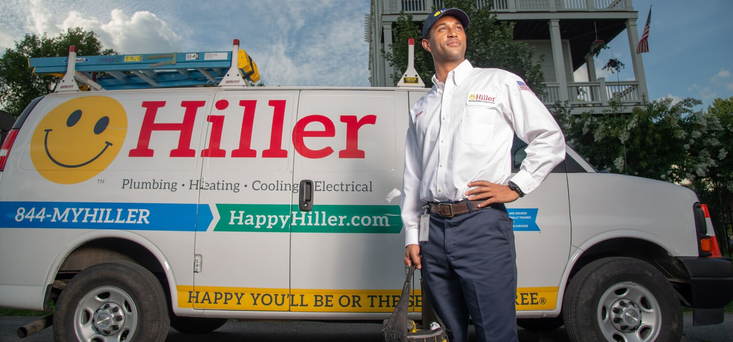 Technician in front of work van