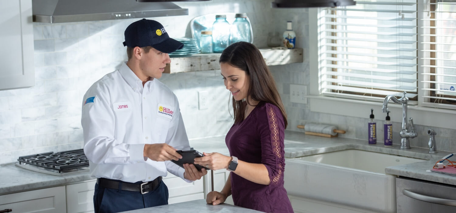 electrician explaining repairs to customer