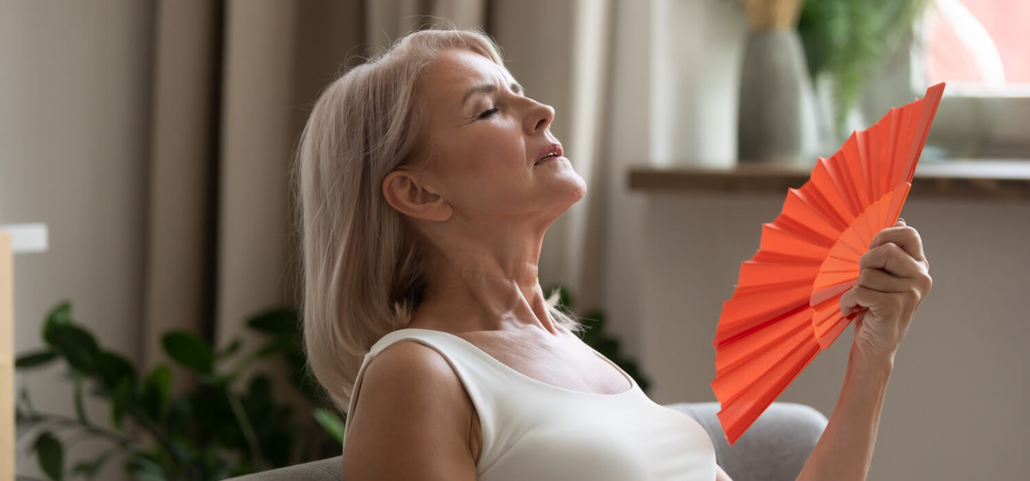 lady fanning beacuse of common air conditioner problems