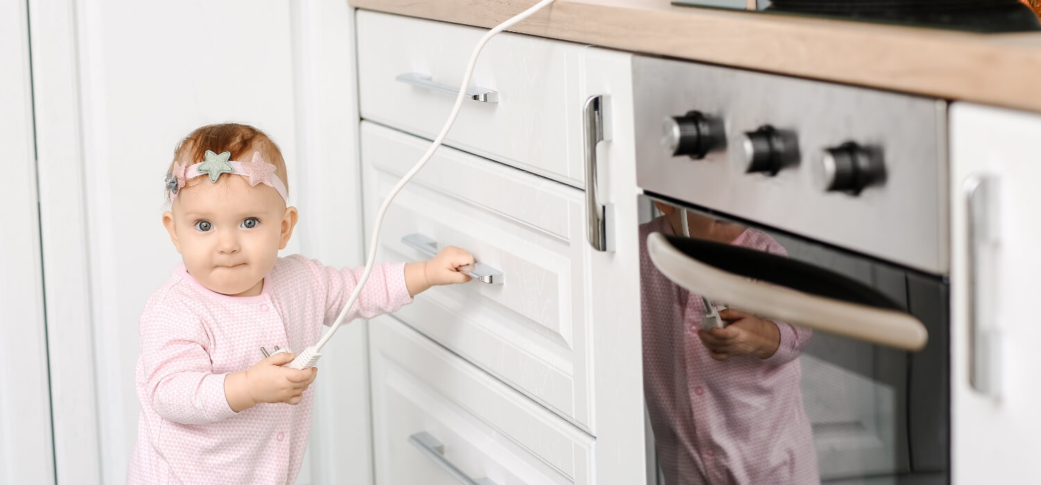 baby playing with plug