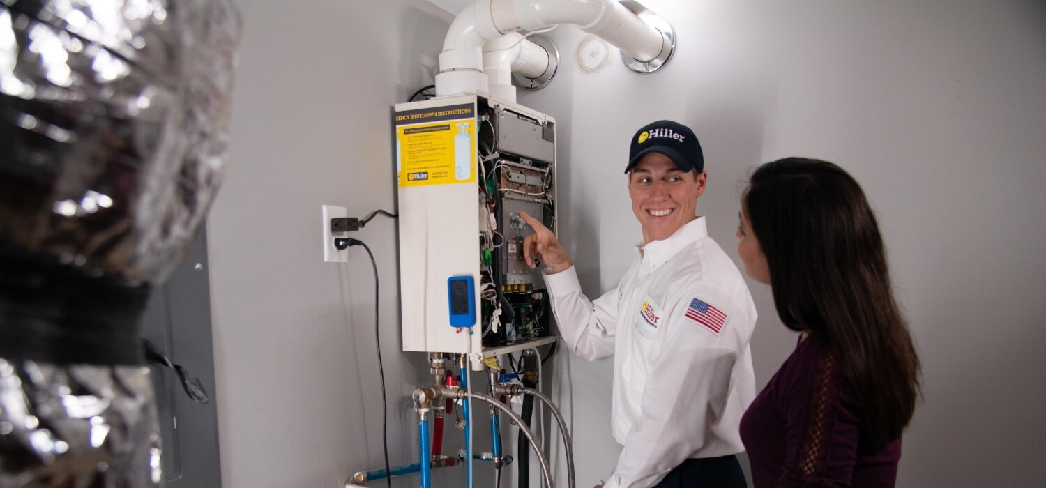 technician showing customer ger gas tankless water heater