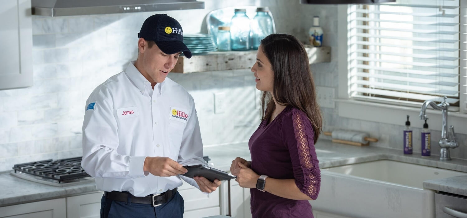 technician going over warranties for a tankless water heater