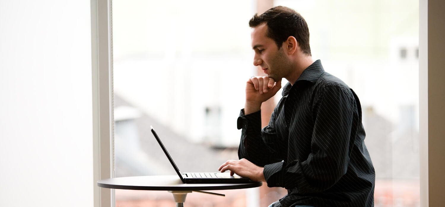 man researching on computer