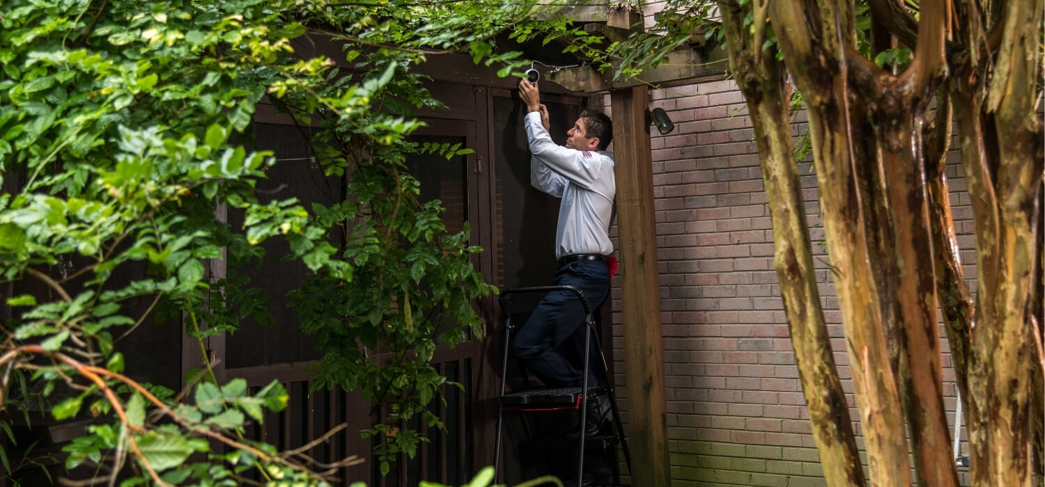 technician installing smart home camera