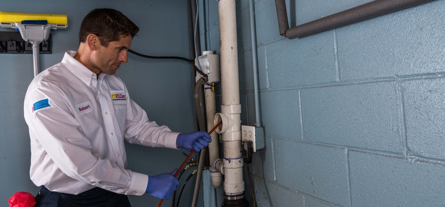 Plumber Running Camera Into Drain