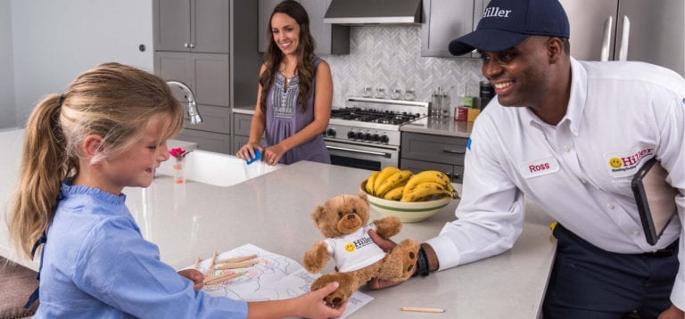 plumber near me giving child a bear