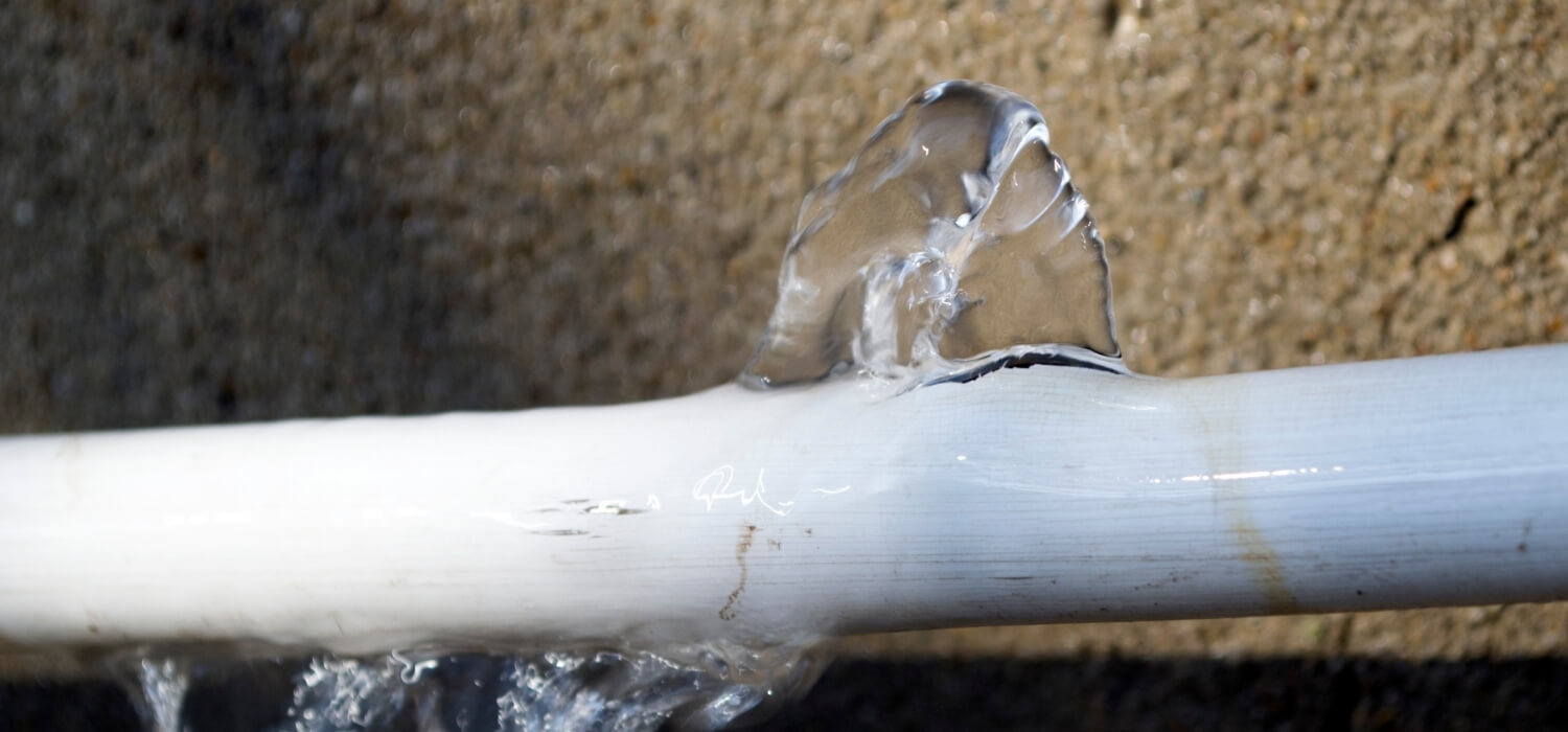 Cracked Frozen Pipe with Water Frozen