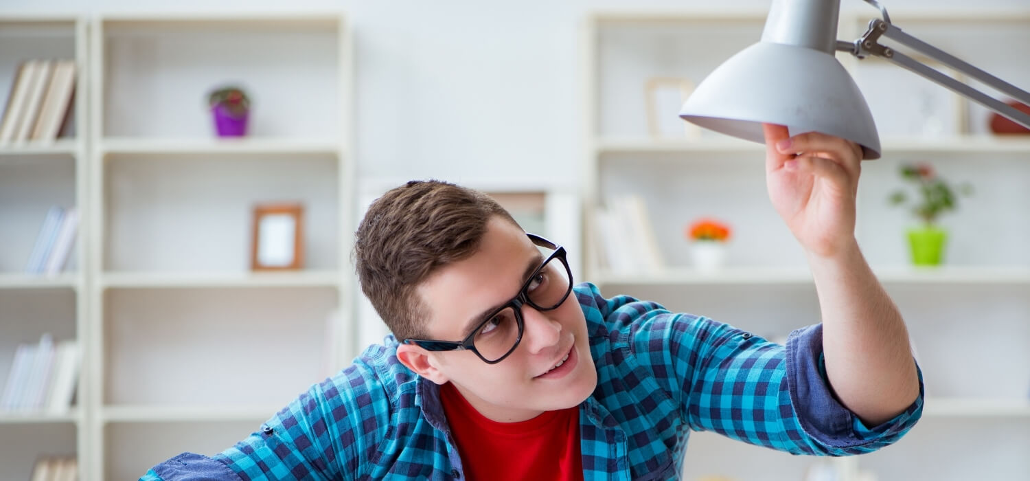 Student Trying to Fix Flickering Light in Lamp