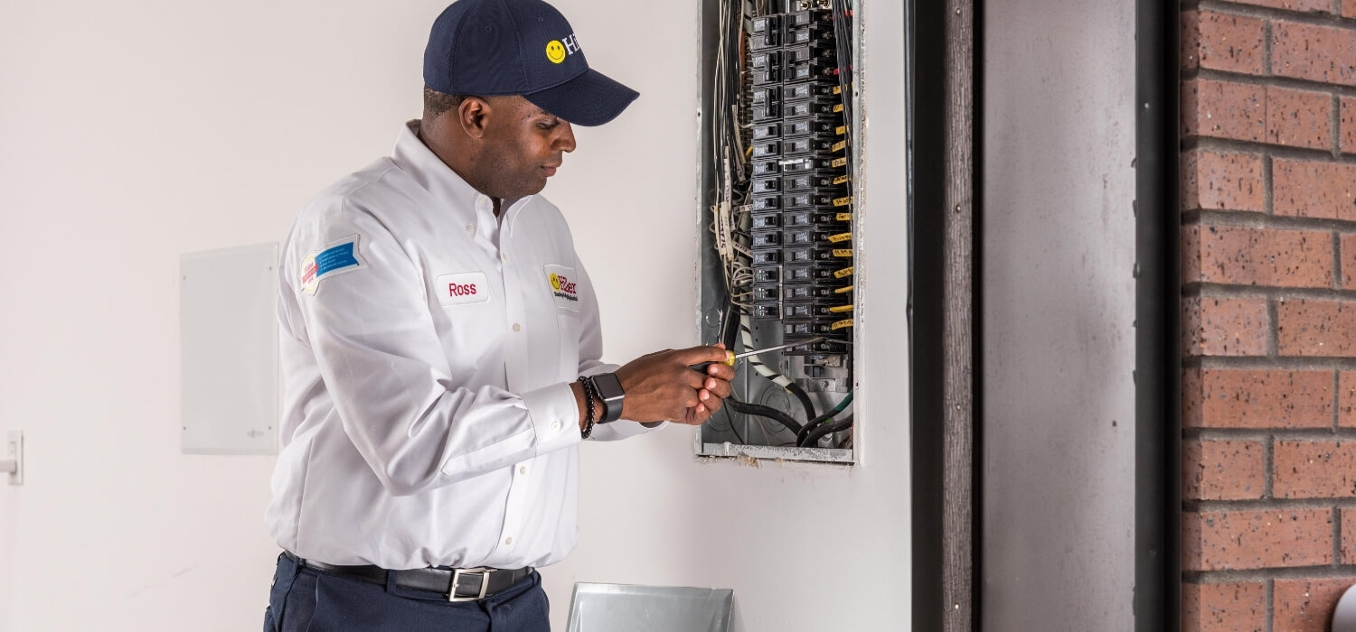 Hiller Electrician Working on Breaker Panel