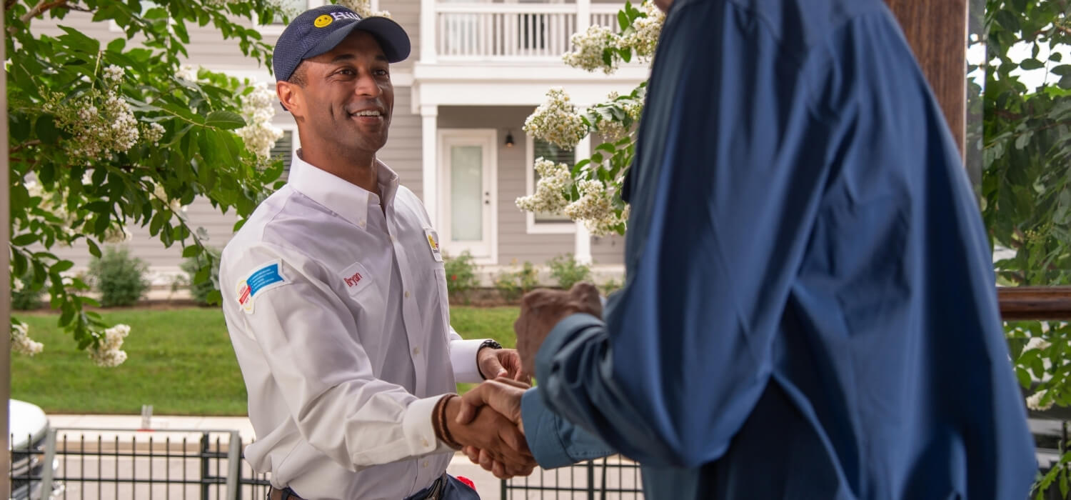 Hiller Professional Plumber Greeting Customer