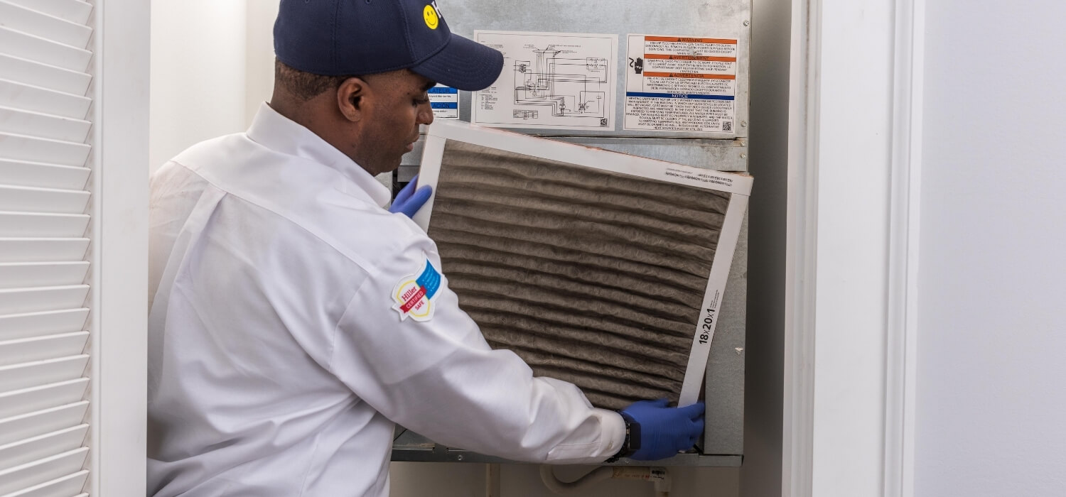 HVAC Technician Changing the Air Filter