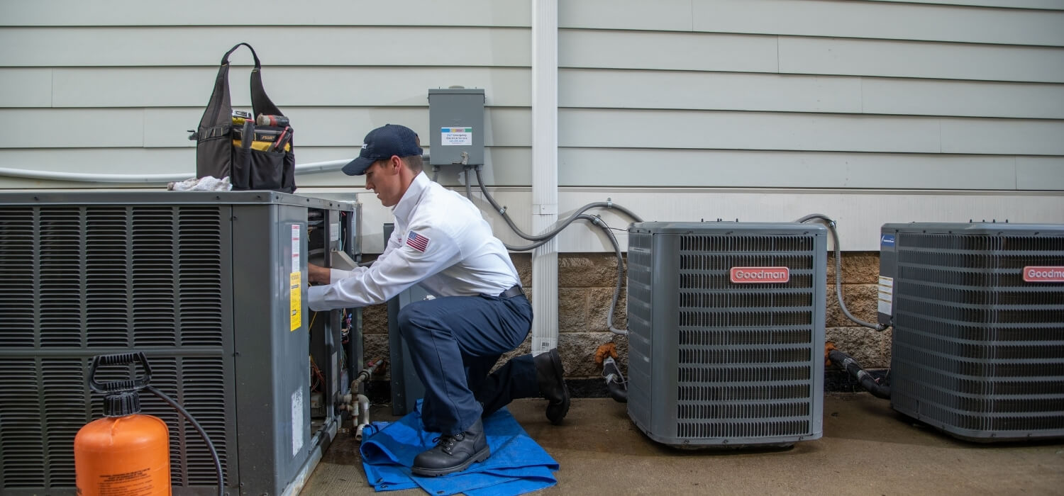 Hiller HVAC Technician Repairing Unit