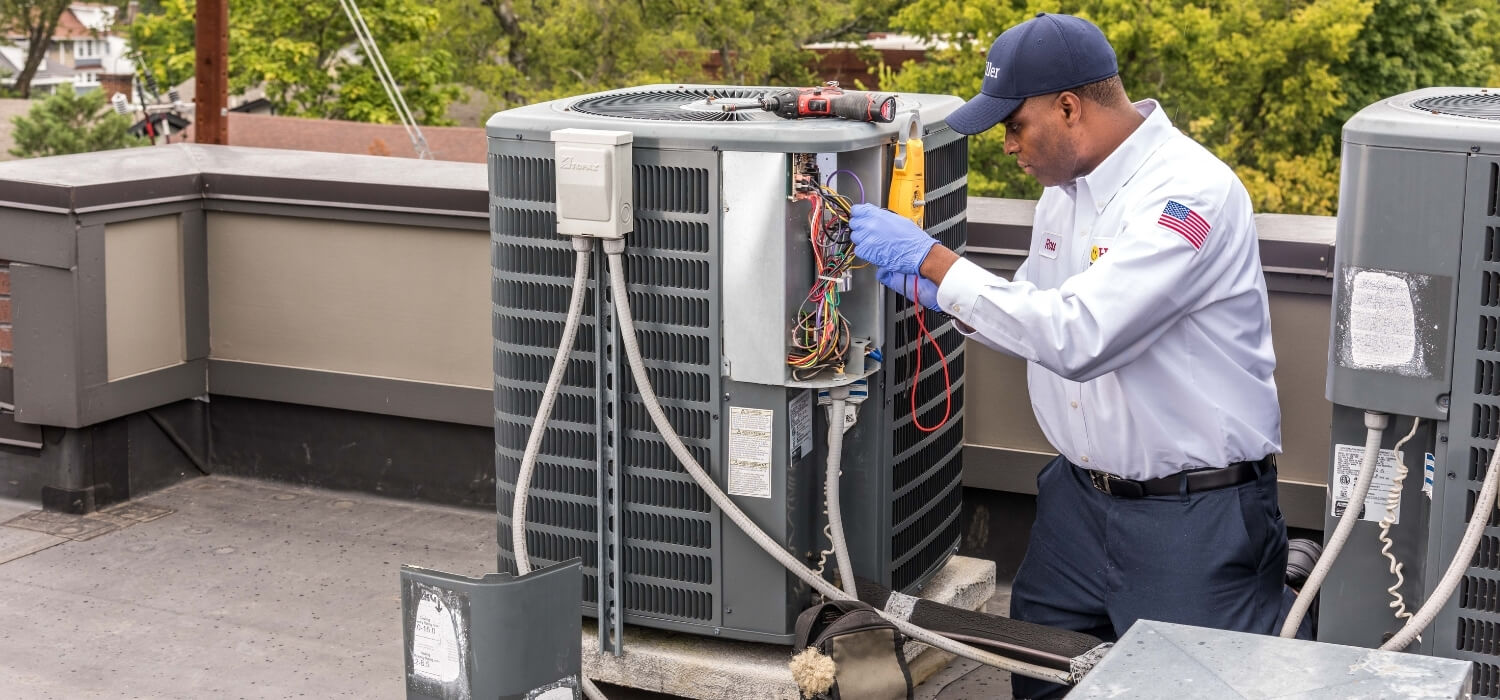 HVAC Technician Working On Unit