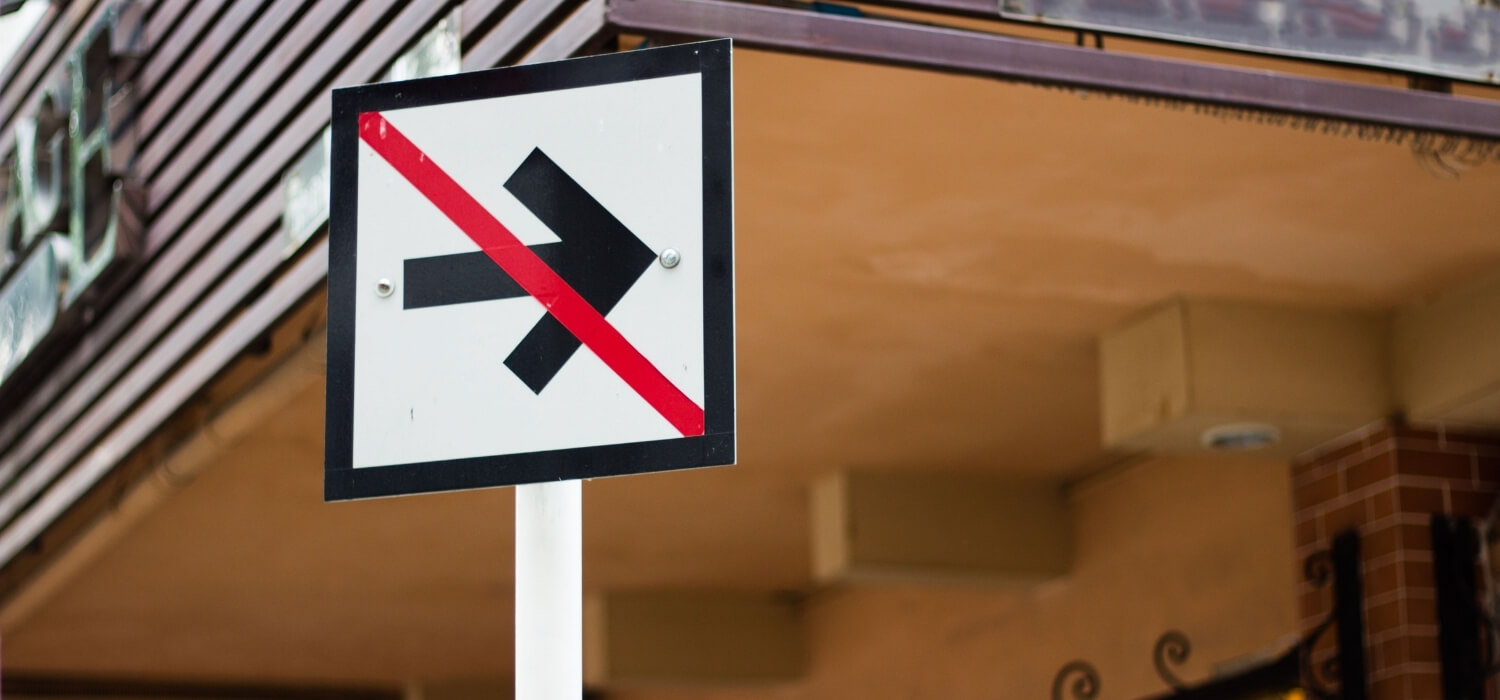 Road Sign of Arrow with a Red Line