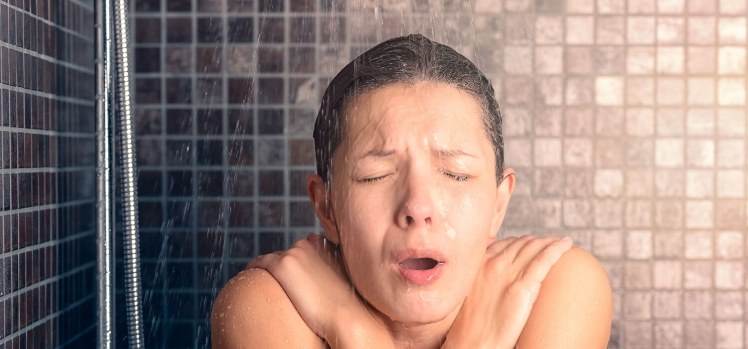 Woman Taking a Cold Shower