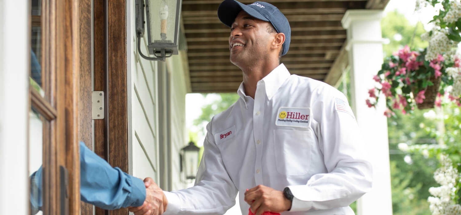 Electrician Greeting Customer that Hired Him