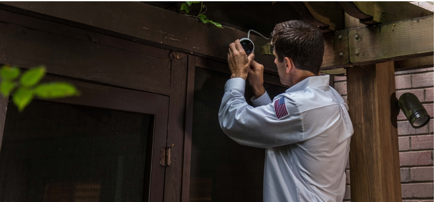 Electrician Installing Smart Security Cameras