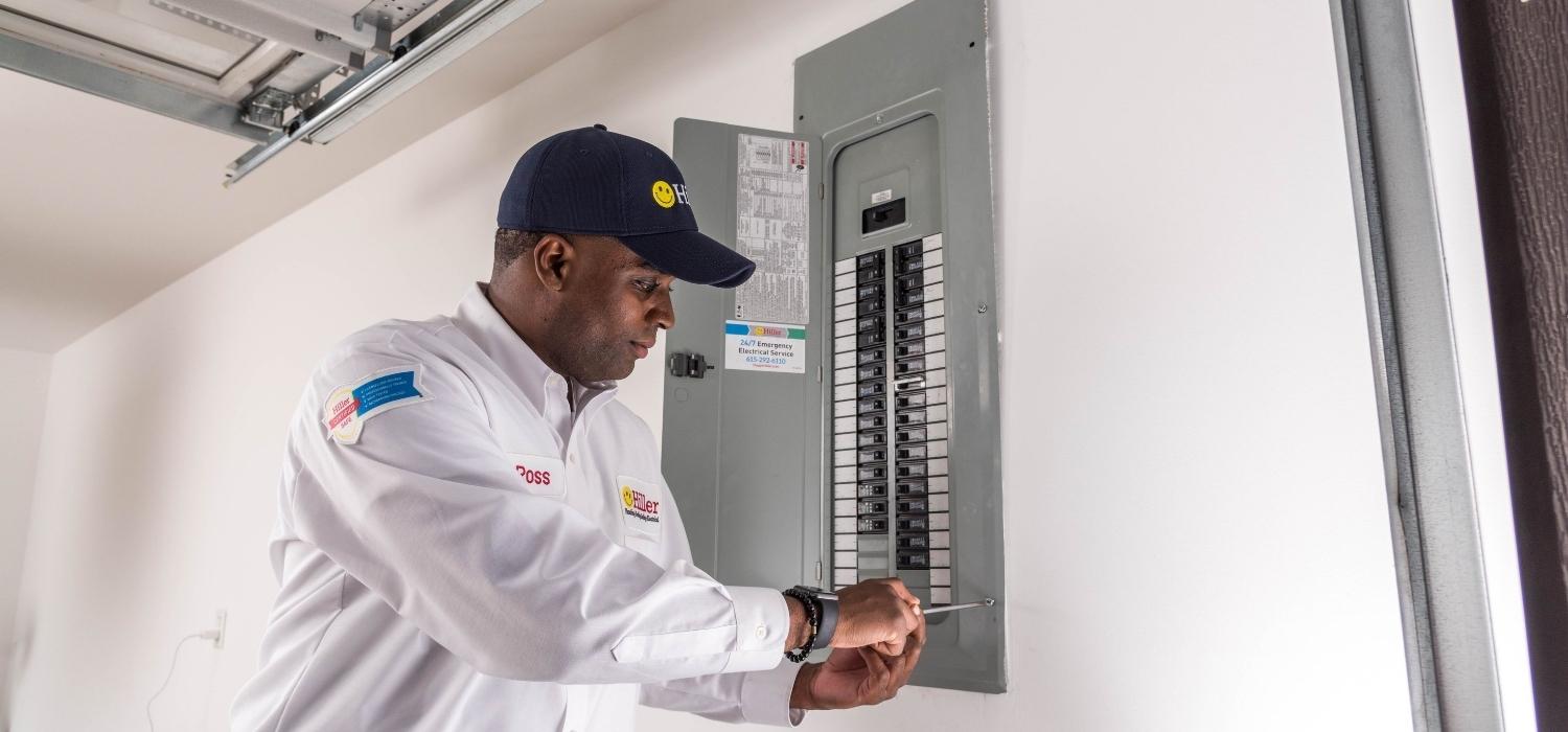 circuit breaker being worked on by technician