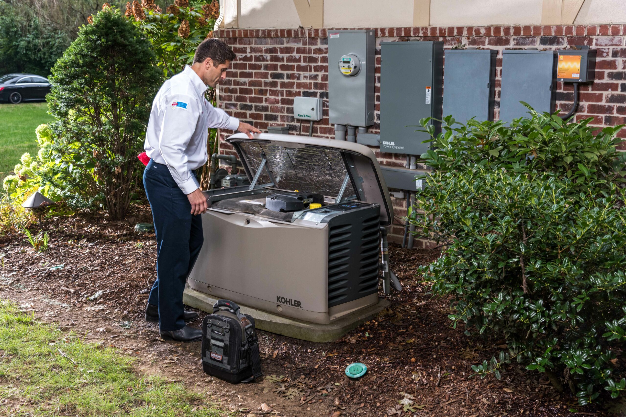 tech repairing a generator 