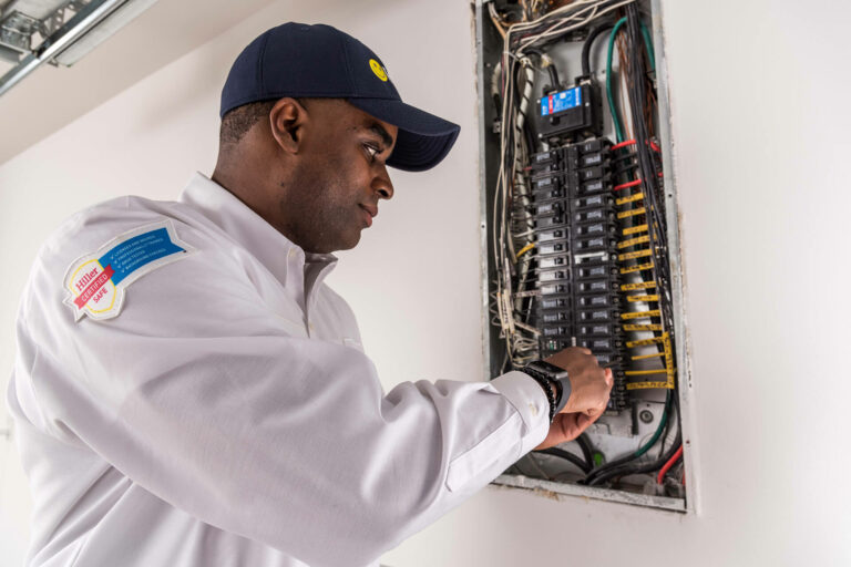 Electrician performing electrical services