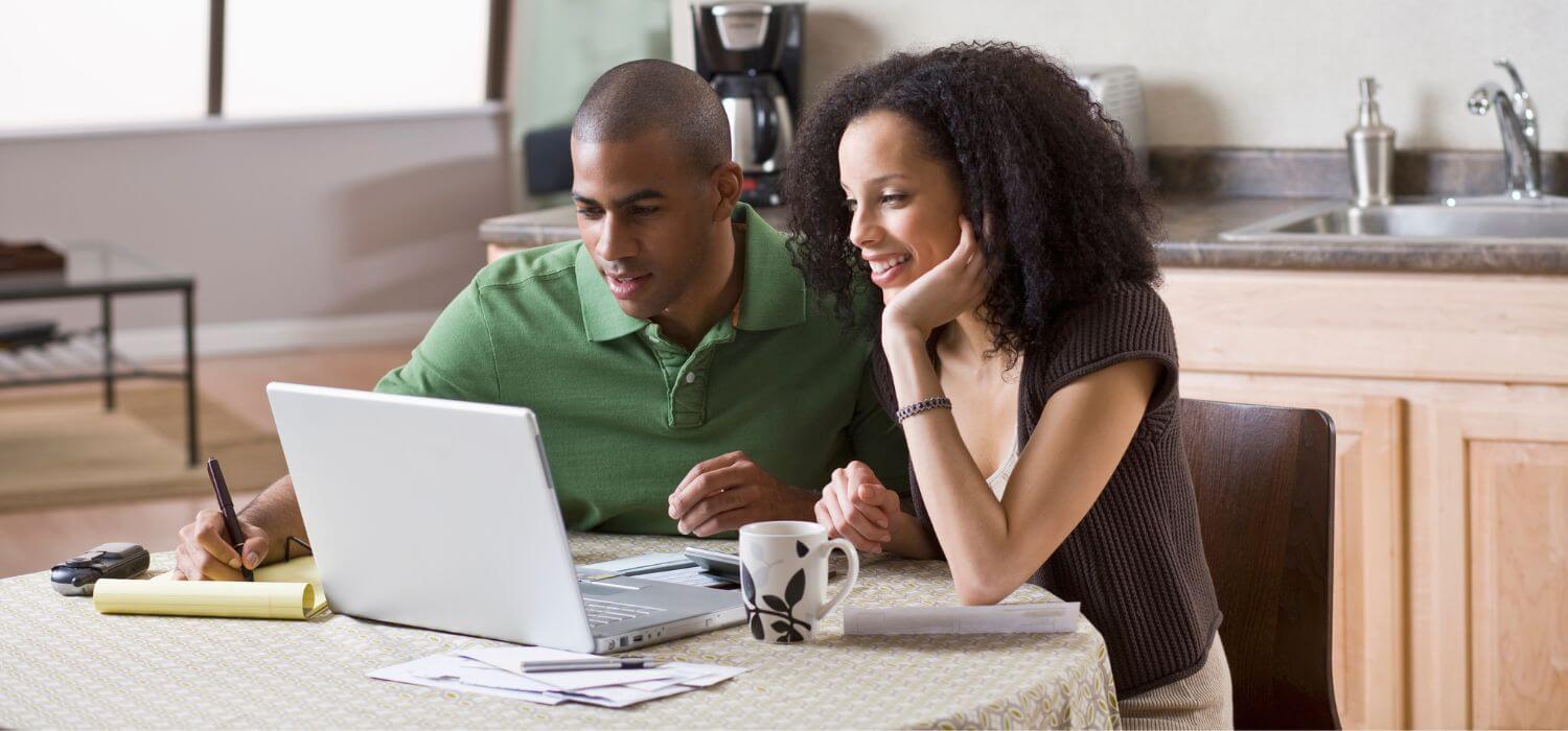 couple-comparing-information-about-hvac-units