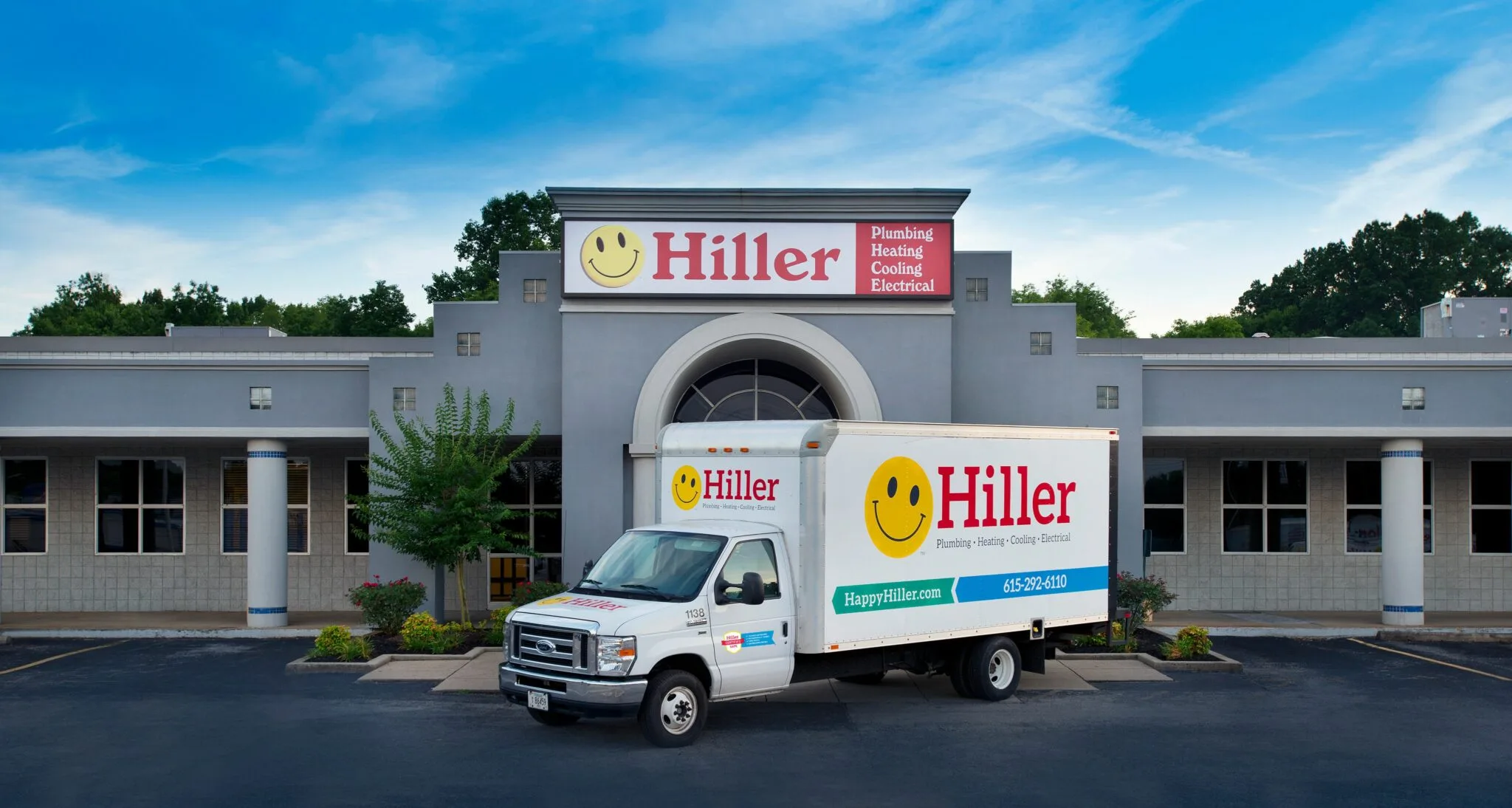 Service truck parked outside company building