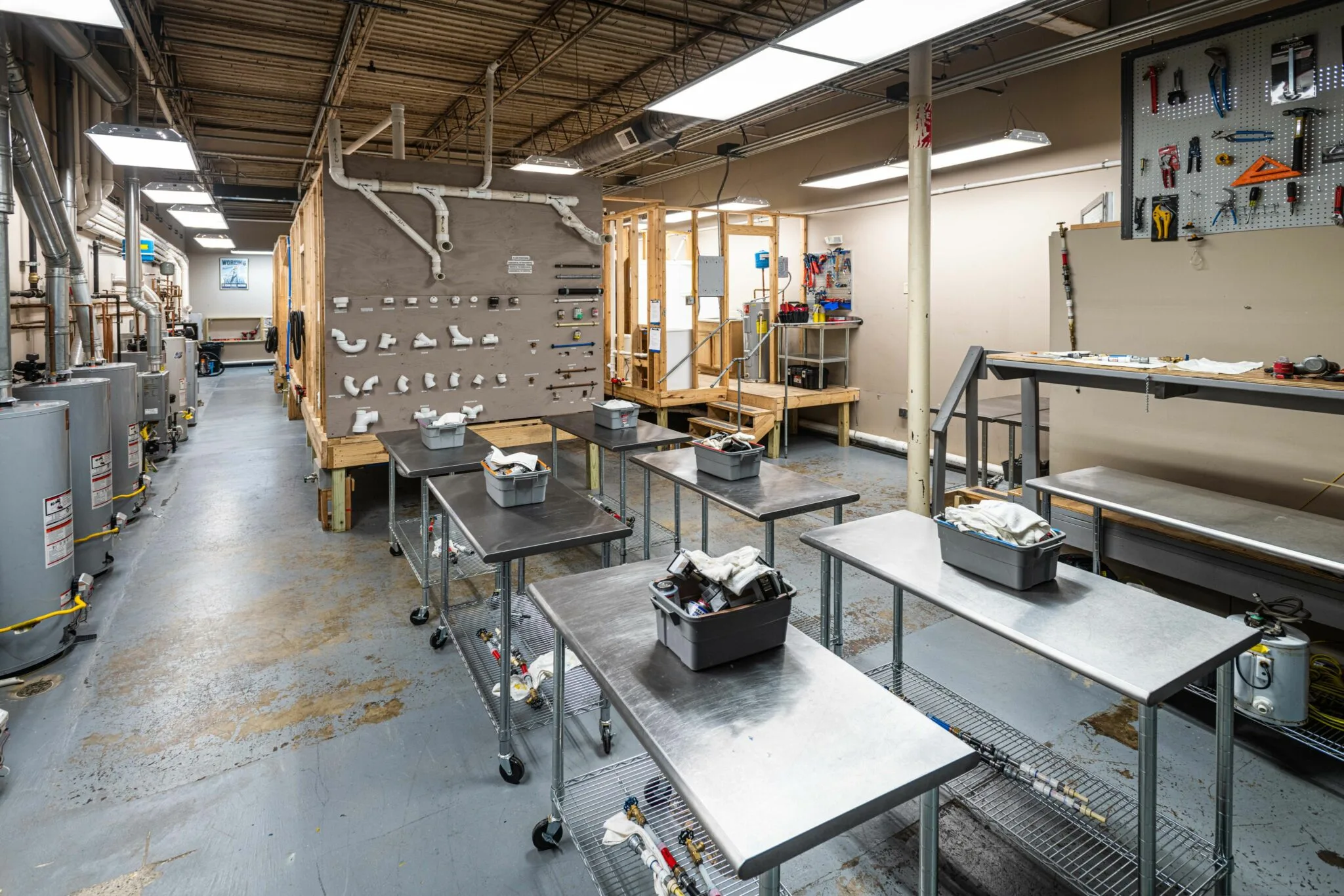 Plumbing training workshop with tables