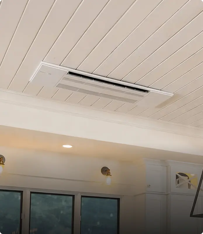 Close-up of a Mitsubishi Hyper-Heat indoor cassette installed in a Nashville residential room.